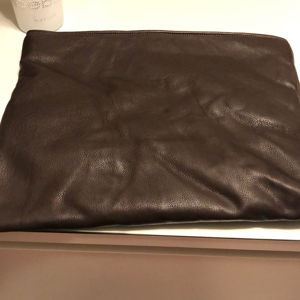 A brown leather clutch